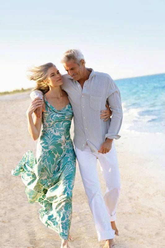 Happy couple walking on the beach